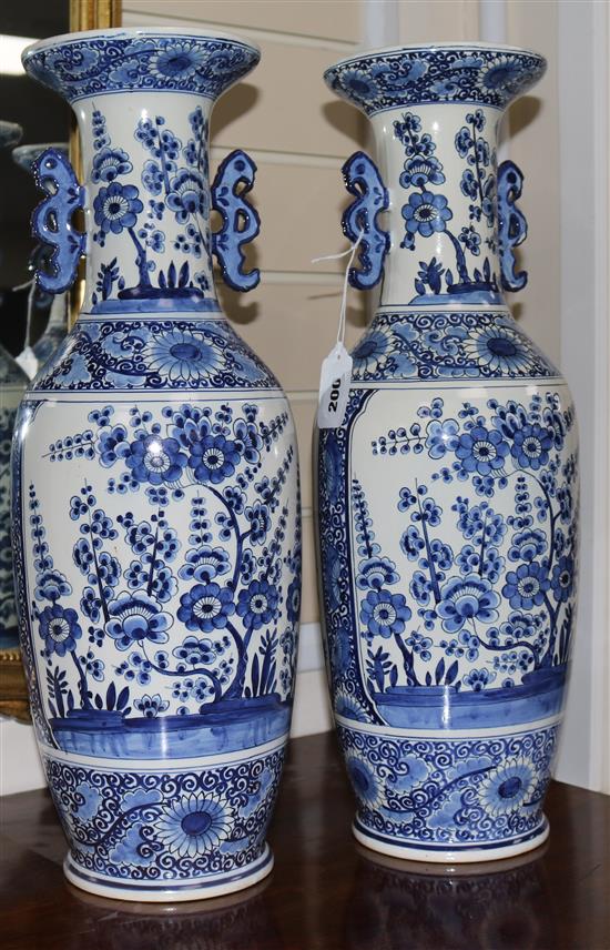 A pair of Chinese style blue and white vases, H.52cm